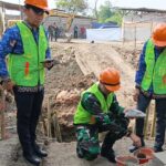 Dandim Serang Letakkan Batu Pertama Pembangunan Jembatan Bantuan Presiden